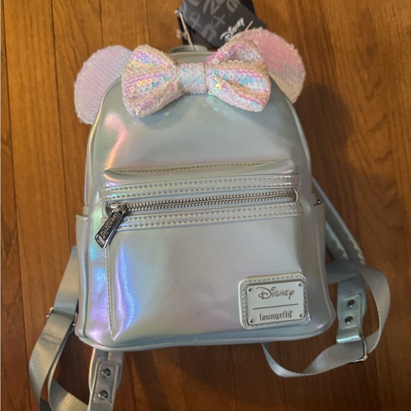 Loungefly Handbags - Loungefly Iridescent Silver Mini Backpack with Pastel Sequin Ears and Bow NWT